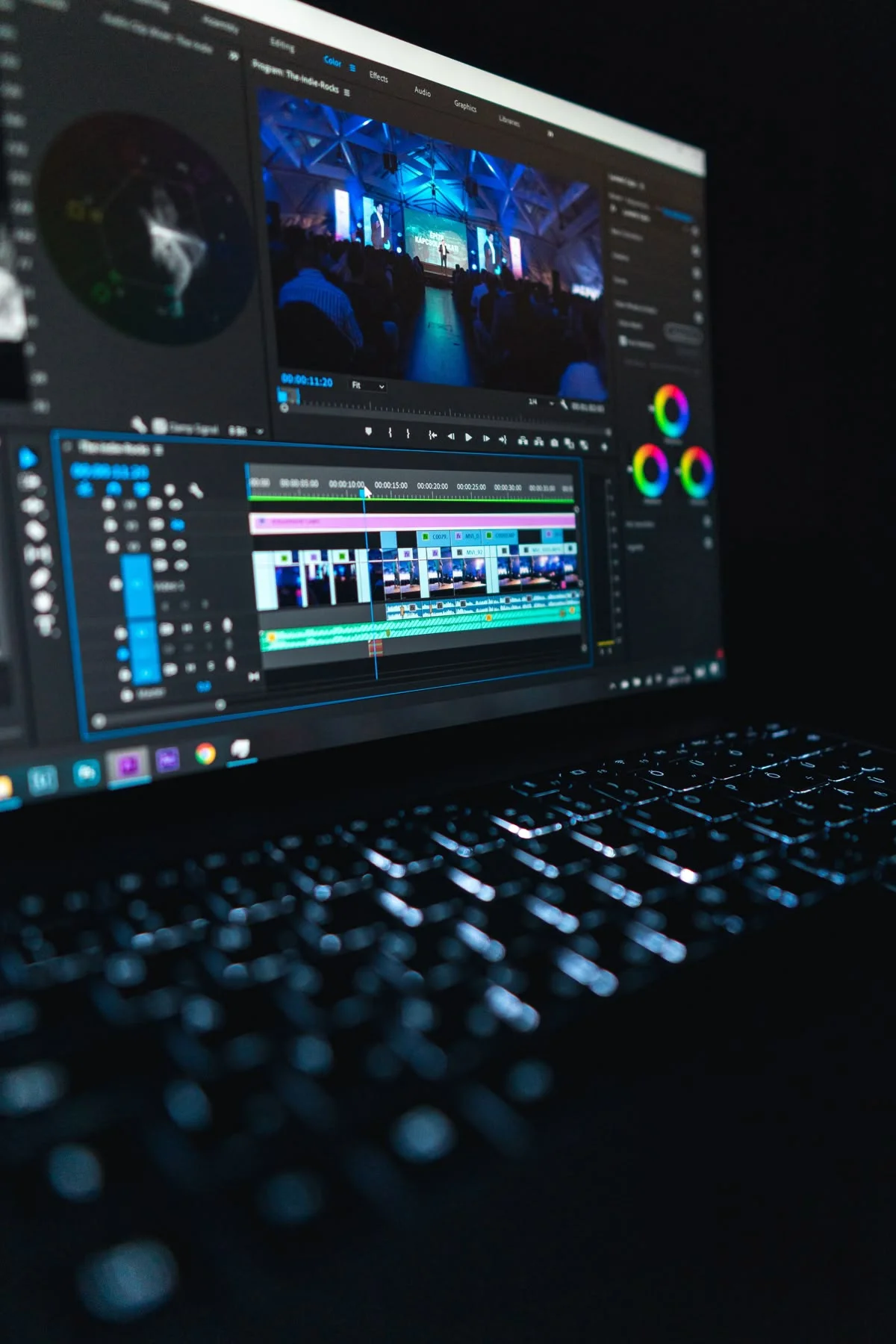 A video editing timeline open on a laptop